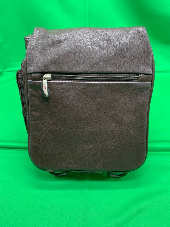 A brown leather Travelon unisex travel bag.