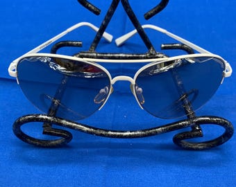 A set of two pre-owned designer Aviator sunglasses.