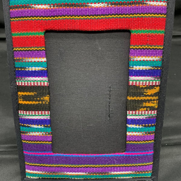 A colorful fabric picture frame South American origin, most likely handmade.