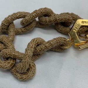 A chain link “python “ bracelet with toggle clasp.