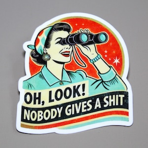 May include: A retro-style sticker featuring a woman looking through binoculars with the text "Oh, look! Nobody gives a shit."