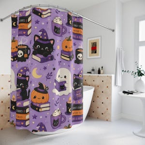 May include: A purple shower curtain with a Halloween theme. The design features black cats wearing witch hats, pumpkins, ghosts, books, mugs of whipped cream, candles, and the text "Stories, Tales, Books", "Ghost Stories, Witchy Tales, Books & Books", and "Spells & Stories".