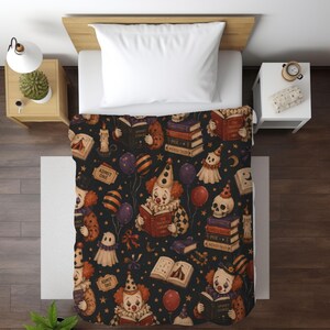 Vintage Halloween clown reading blanket with red‑haired clowns holding spooky books, skulls, candles, tickets, ghosts, stars, and balloons on a black background; available in ultra‑plush sherpa or smooth velveteen styles and in 50x60 and 60x80 inch sizes