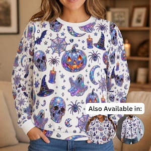 May include: A white long-sleeve sweatshirt featuring an all-over iridescent Halloween print of skulls, pumpkins, ghosts, spiders, spiderwebs, witch hats, candles, and crescent moons. The design includes two circular insets showing other styles.