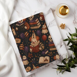 Vintage Halloween clown reading blanket with red‑haired clowns holding spooky books, skulls, candles, tickets, ghosts, stars, and balloons on a black background; available in ultra‑plush sherpa or smooth velveteen styles and in 50x60 and 60x80 inch sizes