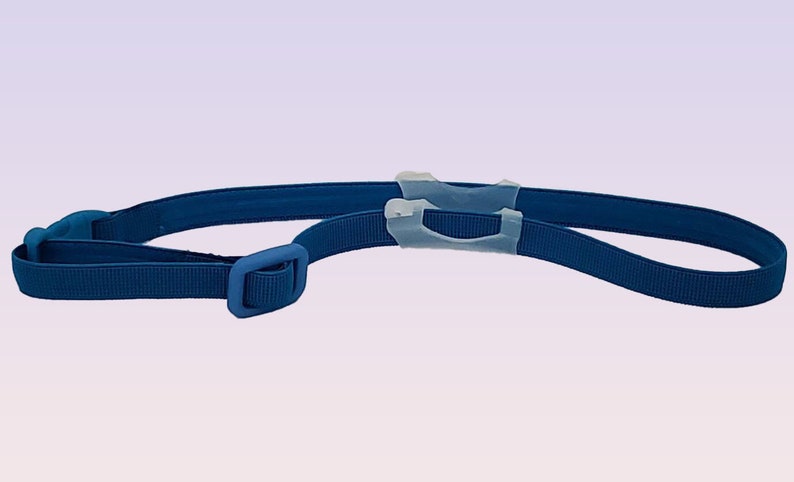 May include: A blue adjustable strap with a plastic buckle and two clear plastic loops.