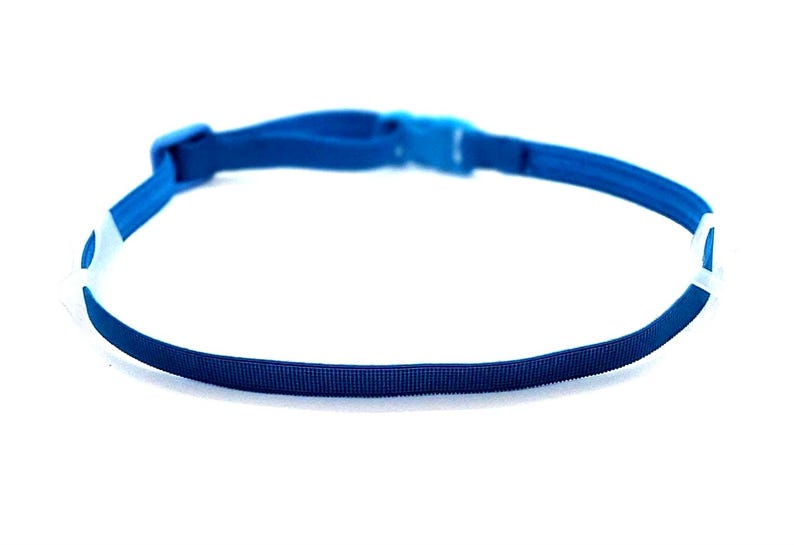 May include: A blue adjustable headband with white plastic clasps on each end.