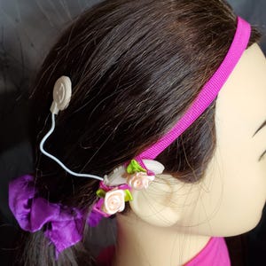 Anti-slip magenta Cochlear headband with loop sleeves plain or with flower&#39;s