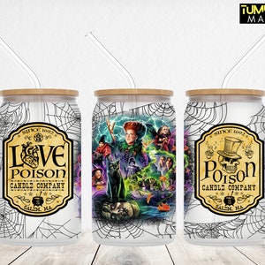 May include: Three white, stainless steel, can-shaped tumblers with black and white spiderweb designs. The tumblers have bamboo lids and clear straws. The front of each tumbler features a different design. The first tumbler has a black and white label with the text "Love Poison Candle Company" and a heart with a skull inside. The second tumbler has a colourful illustration of a witch with a black cat and other Halloween characters. The third tumbler has a black and white label with the text "Poison Candle Company" and a skull wearing a top hat.