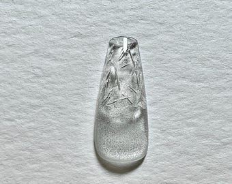May include: A clear, rectangular nail with a textured, frosted appearance. The nail features internal, linear designs. The image includes the text "MIO Ming Original" and "Luxury Handmade Nails".