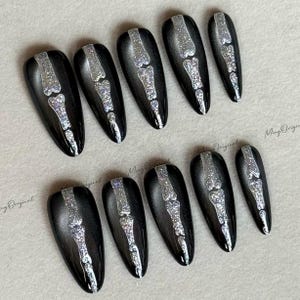 Halloween Shadow Spine Bone press on nails, black cat eye base, silver glitter bone design, spooky season sparkling Gothic nail art, MO615