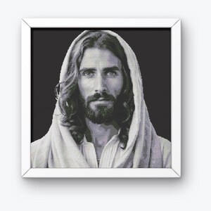 May include: A black and white portrait of Jesus Christ with long hair and a beard. He is wearing a white robe and has a serious expression on his face.