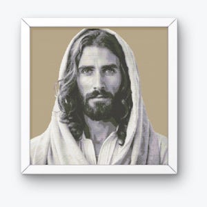 May include: A black and white portrait of Jesus Christ with long hair and a beard. He is wearing a white robe and has a gentle expression on his face.
