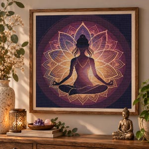 May include: A square framed diamond painting featuring a silhouette of a person in a seated meditation pose centered within a large, glowing purple and gold lotus flower mandala design with intricate dot patterns throughout the artwork.