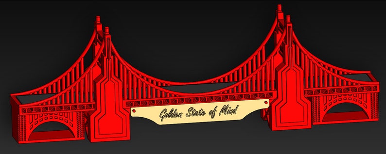 Puede incluir: Modelo 3D impreso en rojo del Puente Golden Gate con una placa de madera que dice "Golden State of Mind".