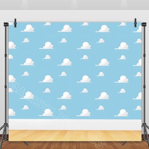 May include: A blue backdrop with a white cloud pattern. The backdrop has a white baseboard and a wood floor.