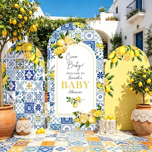 May include: Three arched backdrop panels featuring blue and white Mediterranean tile patterns and yellow lemon illustrations. The center panel displays the text Ciao Baby! WELCOME TO Sarah's BABY SHOWER in black and gold lettering on a white background.