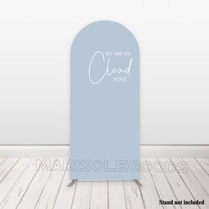 May include: A light blue backdrop with the text "We are on Cloud Nine" in white script font.