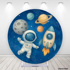 May include: A round backdrop featuring a space theme with an astronaut, rocket ship, and planets against a dark blue starry background. The astronaut is wearing a white spacesuit. The rocket ship has blue fins and orange flames.