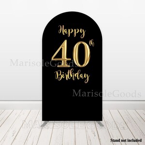 May include: A black arch-shaped sign with gold lettering that reads "Happy 40th Birthday." The number 40 is in a large, bold font. The sign is likely for a birthday celebration.