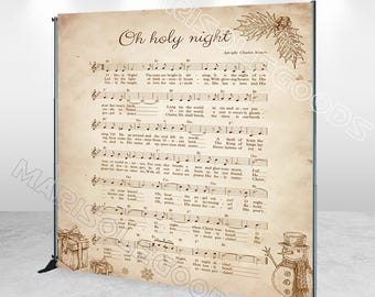 May include: A vintage-style backdrop featuring a sheet music print of the Christmas carol "Oh Holy Night". The backdrop is printed on a parchment-like paper with a brown and cream color scheme. The sheet music is surrounded by a decorative border of holly leaves and berries. A snowman illustration is in the bottom right corner.