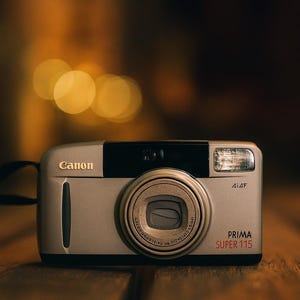 Sleek Canon Prima 115 – 1990s Compact 35mm Point & Shoot Film Camera | Zoom Lens | Tested | Lomography Gift + Film + Battery Included