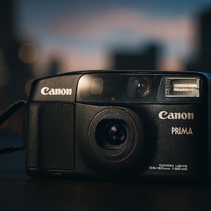 Rare Canon Prima / SureShot Tele 1988 – Dual Lens 35mm Point & Shoot Film Camera | Tested n Working | Collector Gift + Film + Battery + Case