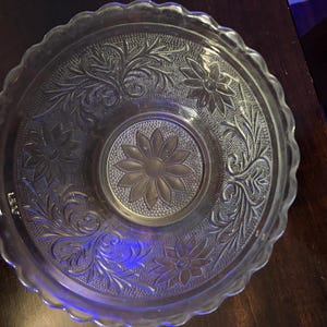 Glass floral embossed scalloped edge ornate serving bowl, dish, flower design in bottom.