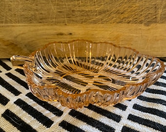 Salmon color depression glass leaf shaped candy trinket dish.