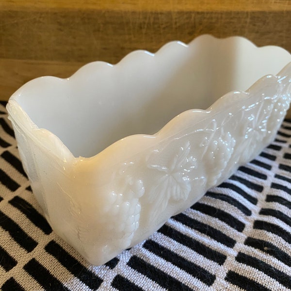 Vintage milk glass dish, planter with grapevine embossing around exterior.  Chipped on one of the corners.