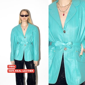 VINTAGE blue leather jacket from 1980s with belt and big shoulder pads by Clan