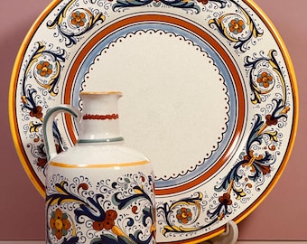 Exquisitely decorated Italian Deruta porcelain plate and pitcher .