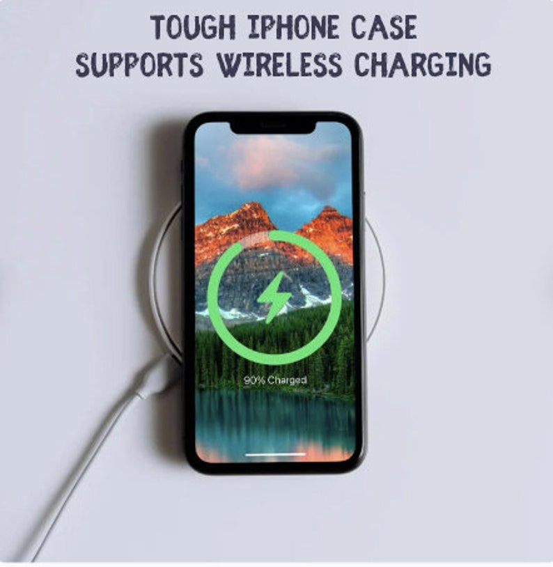 May include: A black iPhone case with a wireless charging indicator showing 90% charged. The phone is on a white wireless charging pad. The text "TOUGH IPHONE CASE SUPPORTS WIRELESS CHARGING" is at the top of the image.