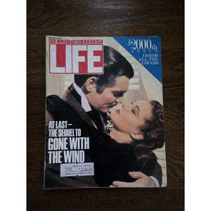 May include: A vintage LIFE magazine cover featuring Clark Gable and Vivien Leigh from the movie "Gone With The Wind." The cover has the text "Collectors Edition" and "Our 2000th Issue Inside All The Covers."
