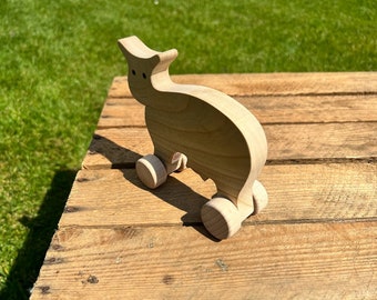 Vache à roulette en bois