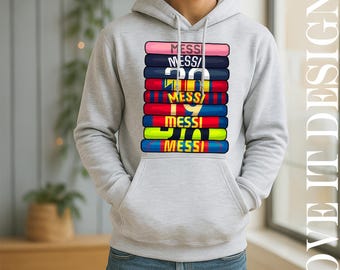 May include: A light gray hoodie with a front graphic featuring the name "MESSI" stacked multiple times in various colors. The number "30" is also visible in the design. The hoodie has a front pocket and a drawstring hood.