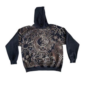 May include: Black hooded sweatshirt with a brown and white graphic print of the Grateful Dead logo and the words "Grateful Dead".