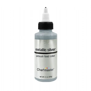 May include: A 2 ounce bottle of metallic silver airbrush food color by Chefmaster. The bottle is silver with a black cap and a white tip.