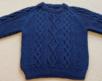 Hand knit child's Aran sweater