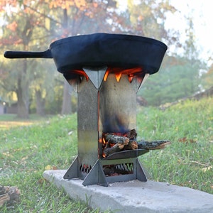 Flat Pack Rocket Stove. Courier Shipped. Stainless, foldable, portable, wood stove for camping. For outdoor cooking, canoe tripping and RV