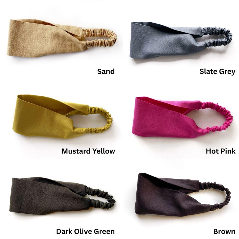 May include: Six headbands in various colors: sand, slate grey, mustard yellow, hot pink, dark olive green, and brown. Each headband features a wide, knotted fabric band with an elasticated section for a comfortable fit. The names of the colors are printed below each headband.