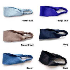 May include: A collection of six headbands in various colors, including pastel blue, indigo blue, taupe brown, navy, denim, and black. Each headband features a twisted knot design and an elastic band for a comfortable fit.