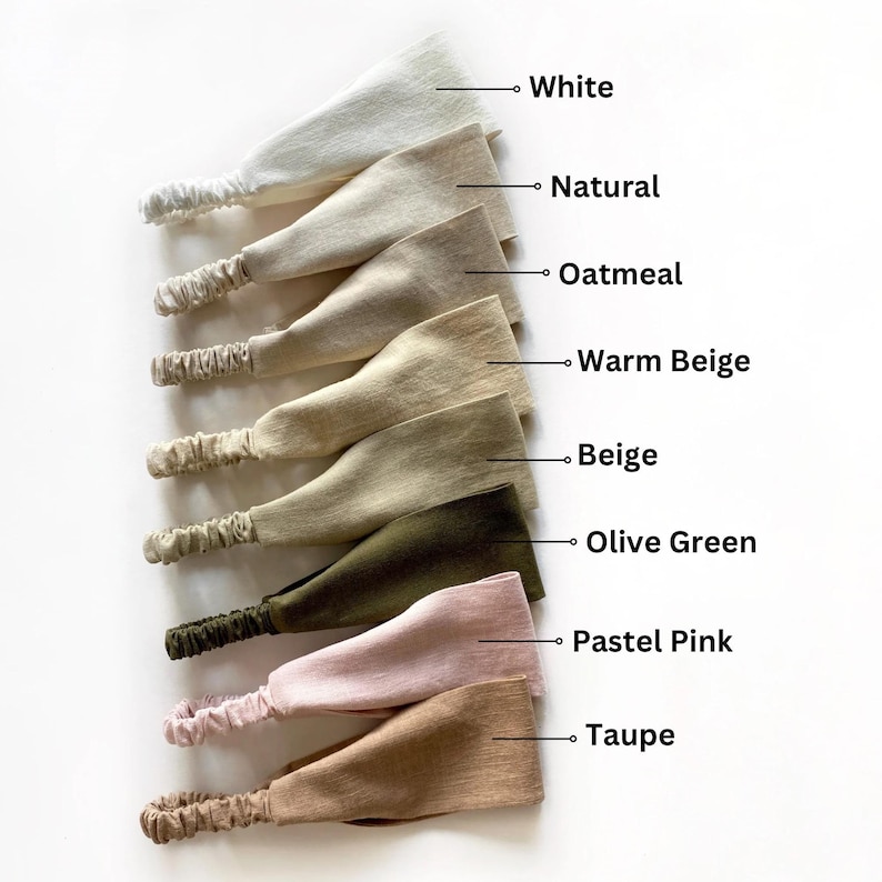 May include: A collection of eight fabric headbands in various colors, including white, natural, oatmeal, warm beige, beige, olive green, pastel pink, and taupe. Each headband features an elastic band for a comfortable fit.