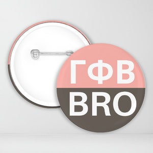 May include: A pink and brown button with the text "GΦB BRO" in white letters.