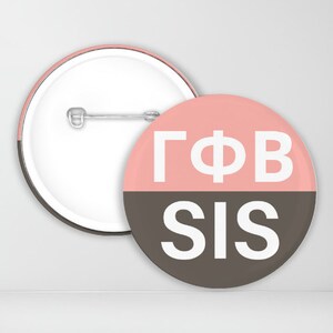 May include: A pink and brown button with the text "GΦB SIS" in white.