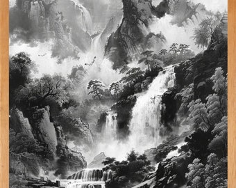 May include: Black and white landscape art print of a mountain scene with waterfalls and trees. The artwork is framed in a light brown wooden frame. The image depicts a misty, natural environment.