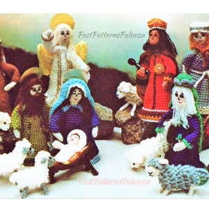 May include: A crocheted nativity scene with figures of Mary, Joseph, baby Jesus, an angel, three wise men, and sheep. The figures are all dressed in colorful clothing and have detailed features.