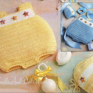 May include: A yellow crocheted baby outfit with a white stripe and rainbow star accents. The outfit is laid out on a light pink surface with a white crocheted hat and a rattle.