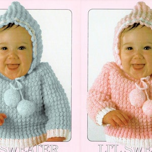 May include: Two crocheted baby sweaters with hoods and pom-poms. One is light blue and the other is pink.