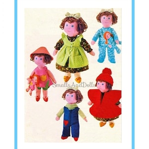 Peut inclure: Plusieurs poupées faites à la main, chacune avec des tenues et des coiffures uniques. Les poupées portent des robes, des salopettes et des pyjamas aux couleurs vives. L'une porte un chapeau et une cape rouges, une autre tient une petite poupée.